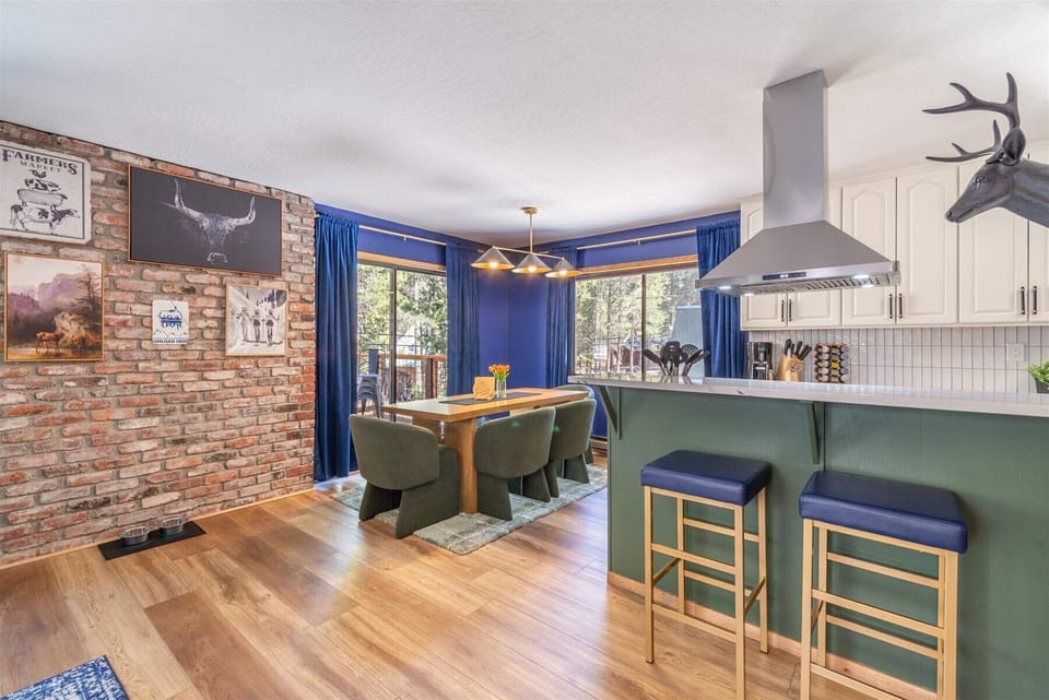 Your stylish open-plan kitchen and dining area blends rustic charm with modern comfort, perfect for cooking and gathering together.