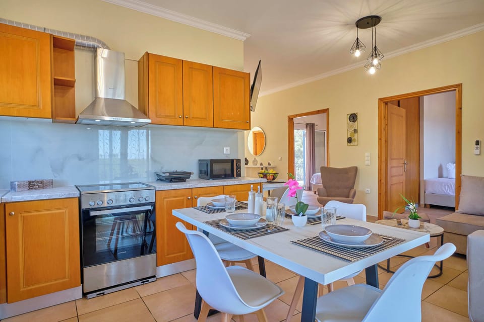 Villa Ilios Agios Spyridonas Kitchen And Dining Area 