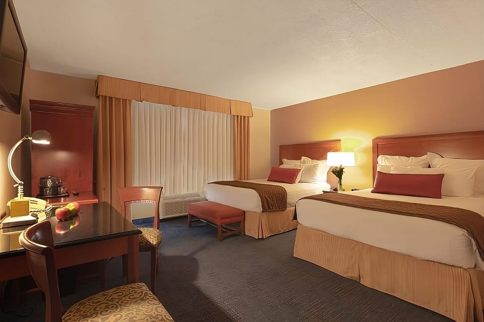 Relax after a long day in warm, inviting double-queen bedding.