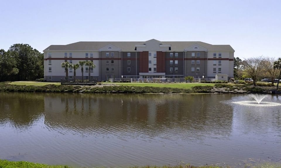Wake up to peaceful waterfront views beside the hotel exterior