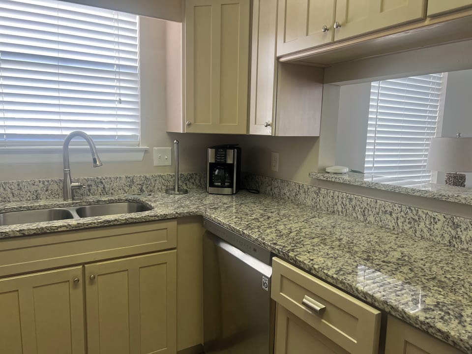 Your fully equipped kitchen features granite countertops, stainless appliances, and everything you need for your stay.