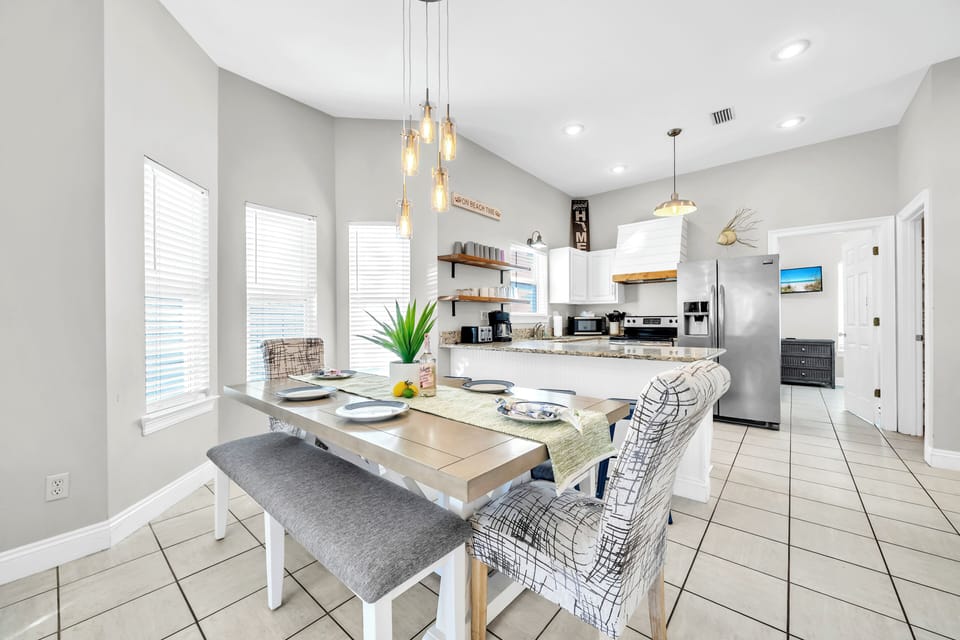 Gather around your stylish dining table where meals become memories, with a fully equipped kitchen just steps away for culinary adventures.