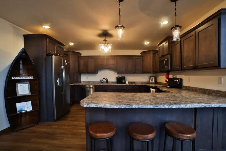 Kitchen with all appliances and cookware. 