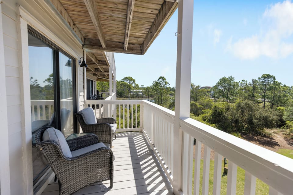 Sip your morning coffee while gazing at the peaceful tree-lined surroundings from your private covered balcony.