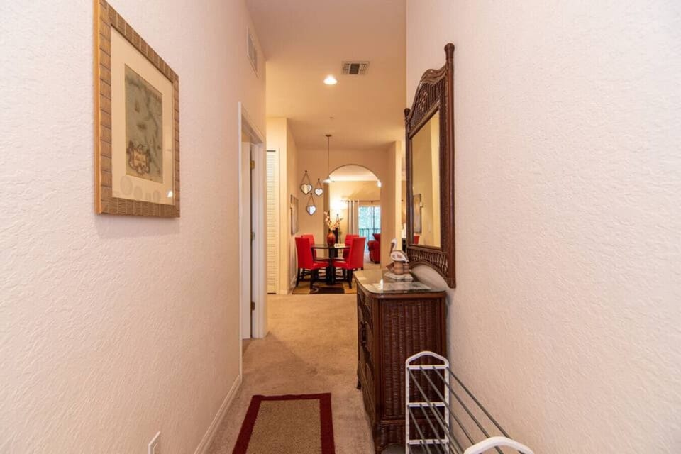 Welcoming hallway leading to the dining area and main living spaces.
