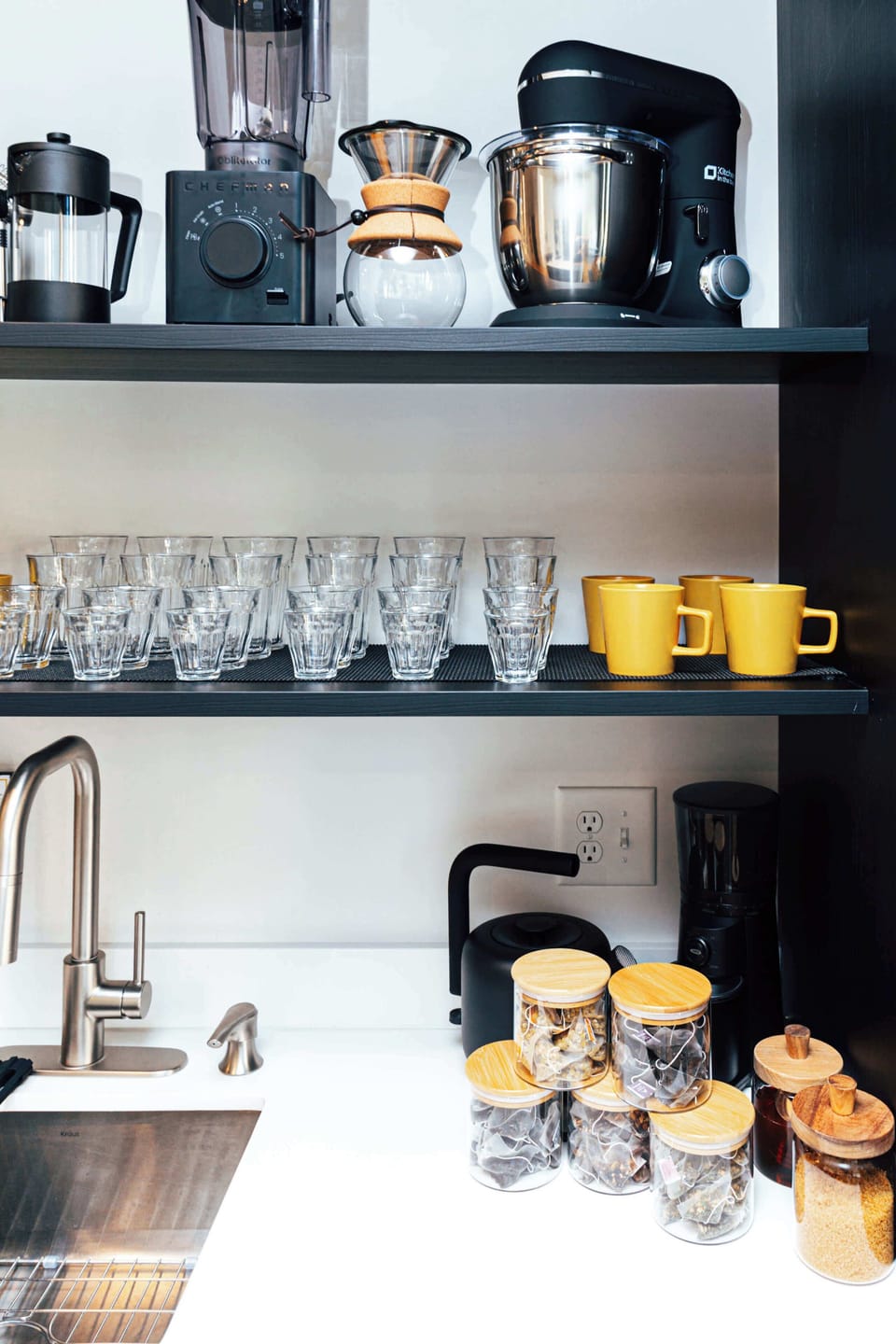 Every element is considered — from the stand mixer and blender to hand-selected teas and spices for at-home comfort.
