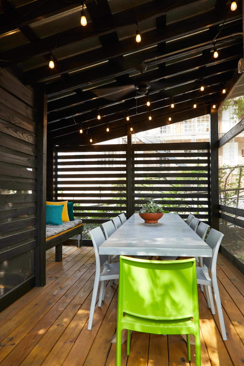 A private, screened outdoor dining room is perfect for enjoying a meal outside.
