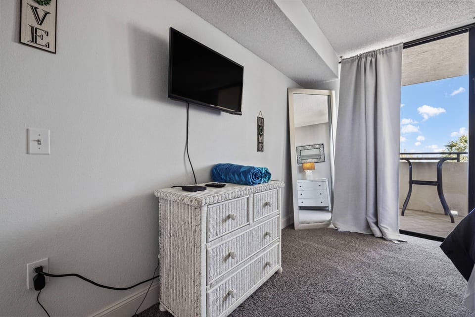 Queen bed with TV