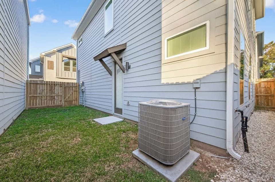 Private fenced backyard with patio access—perfect for fresh air, relaxation, and added privacy during your stay.