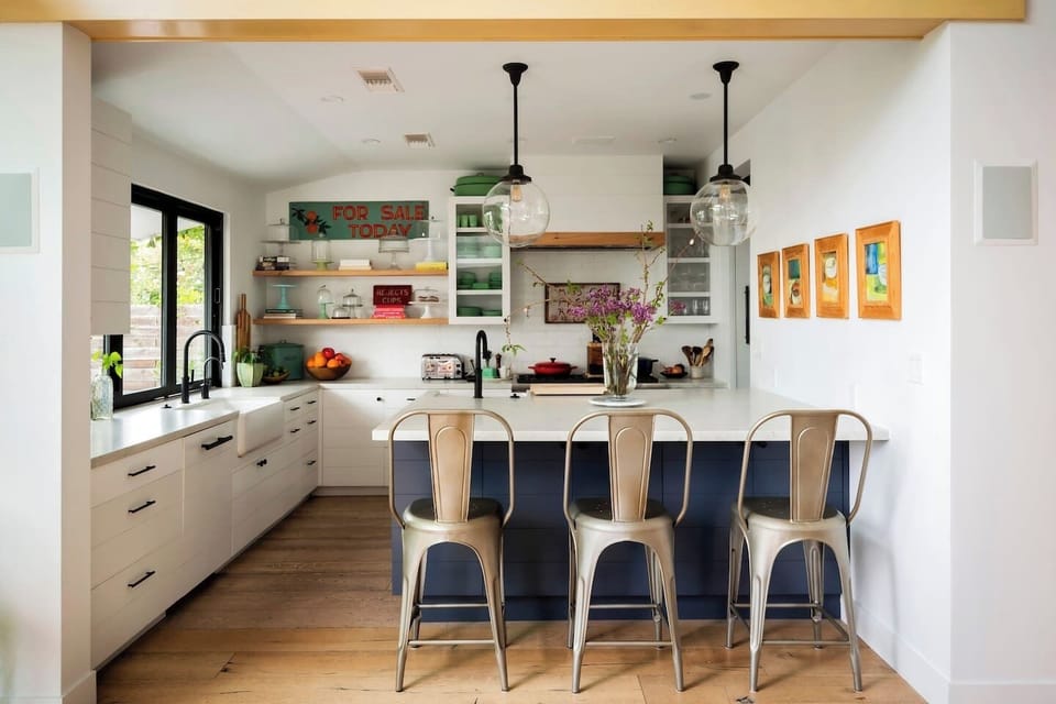 A bright, fully equipped kitchen with an island — ready for everything from morning coffee to dinner with friends.