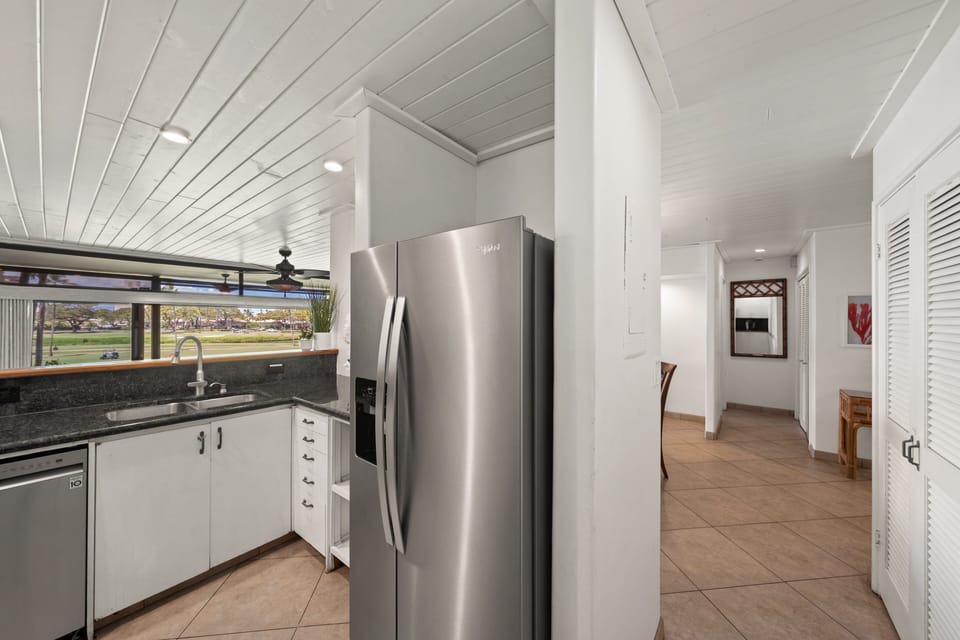 Open kitchen layout connects smoothly to the hallway and living areas.