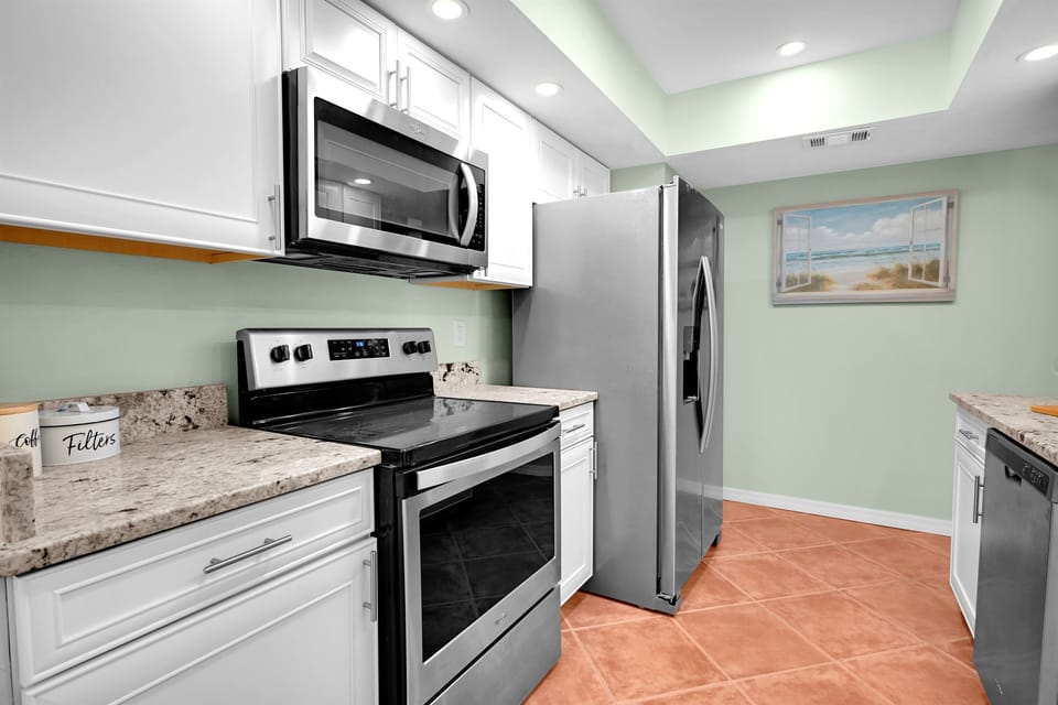 Full kitchen - includes everything you need from pots and pans to cups, plates and silverware. small appliances including microwave, coffee maker, blender, and air fryer are on site and ready for use.