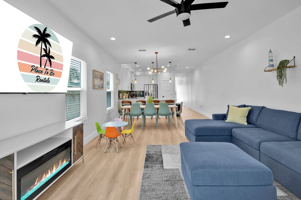 Living Room #1 - large sectional, 75in TV, electric fireplace, board games.