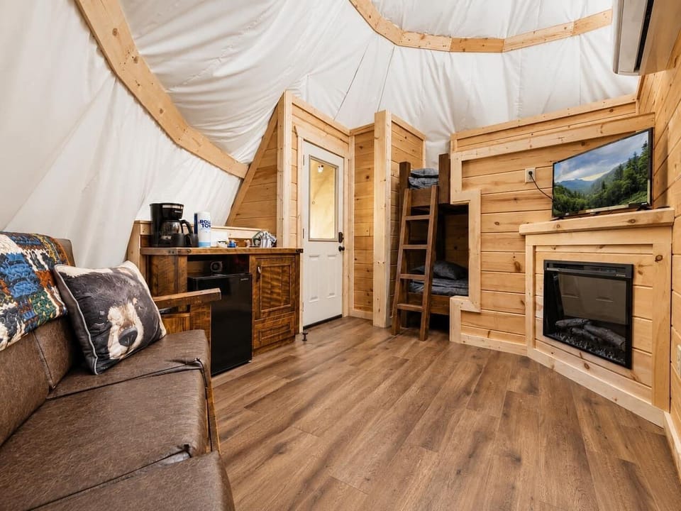 Cozy interior entrance area highlighting the rustic wooden flooring and warm.