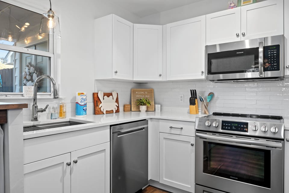 Your bright, fully-equipped kitchen features modern appliances and ample counter space for preparing memorable meals during your stay.