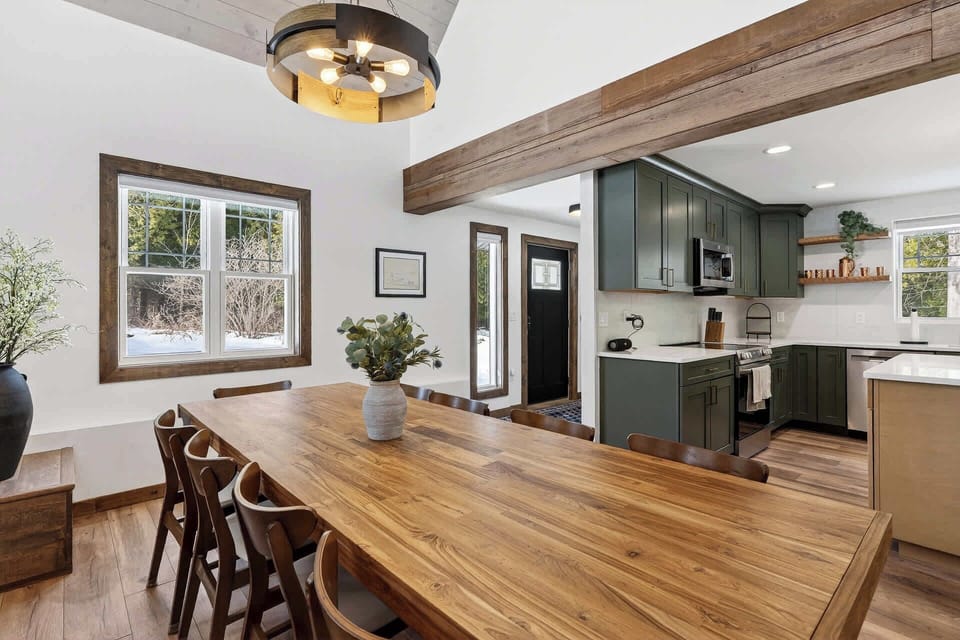 Your open-concept dining and kitchen space blends rustic charm with modern comfort—perfect for gathering over home-cooked meals.
