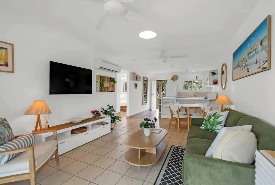 Stretch out with a movie or relax into the seamless flow between living, dining, and kitchen, designed for easy, connected living.