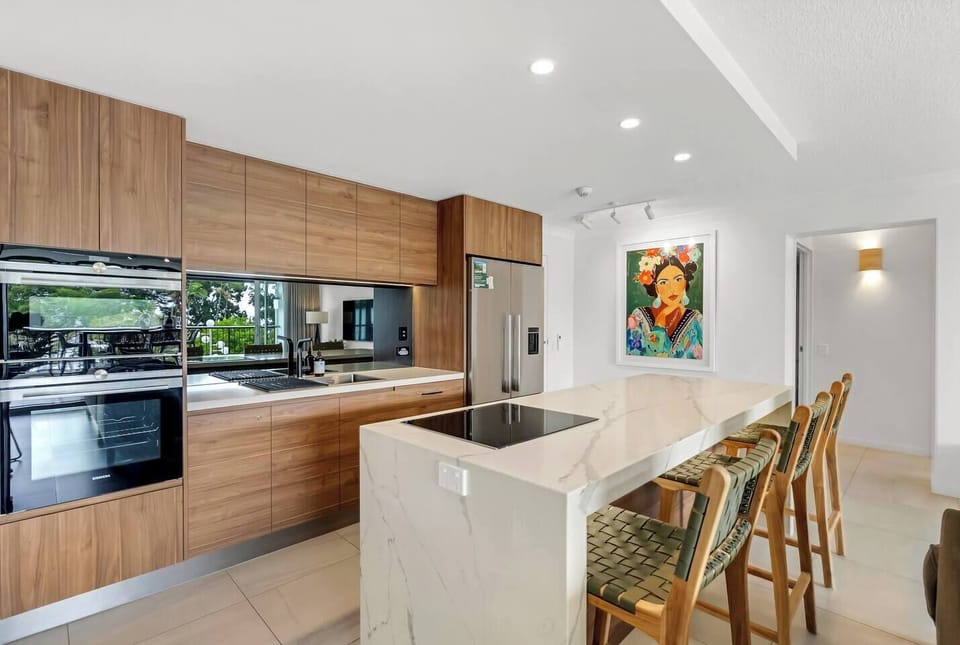 Cook with ease in the sleek, fully equipped kitchen, designed for everything from quick breakfasts to shared dinners.