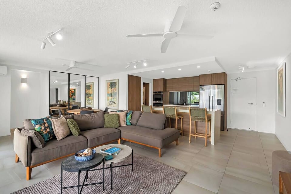 Move effortlessly through the open-plan layout, where living, dining, and kitchen spaces connect for easy, social living.