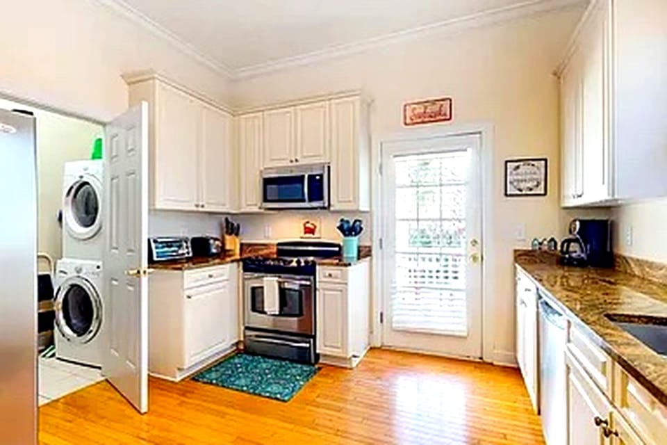 Convenient laundry room and a peaceful back porch overlooking Equestrian Trail.