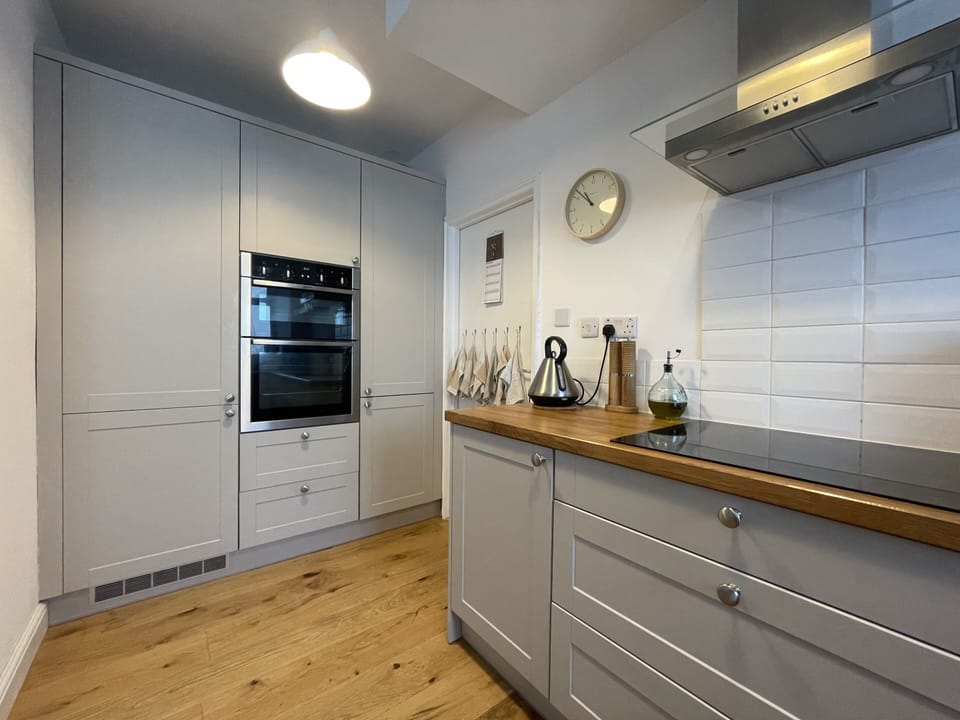 The kitchen features modern appliances for all your cooking needs