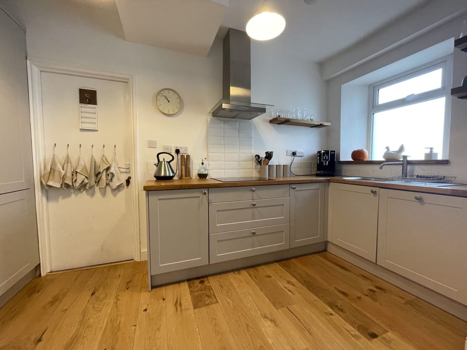 The kitchen features modern appliances for all your cooking needs