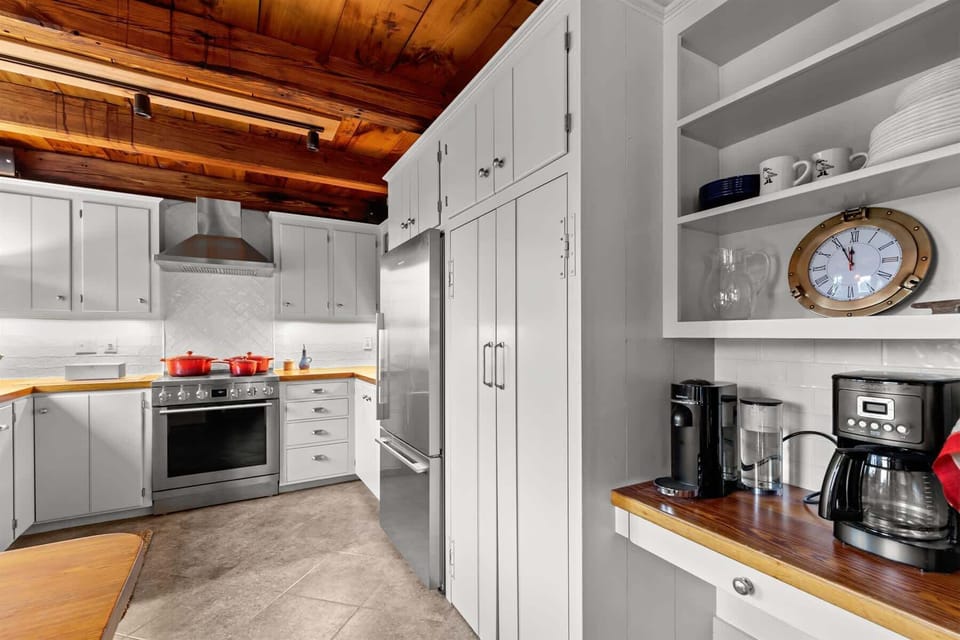 Dedicated coffee station and generous storage make this updated kitchen as practical as it is polished.