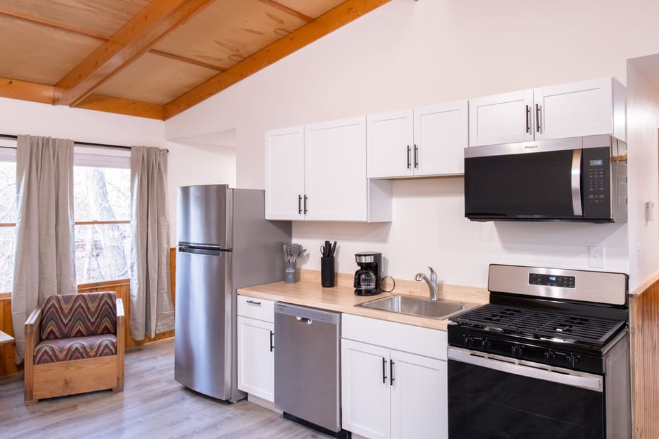 Cook your favorite meals using the gas range in a bright and inviting kitchen.