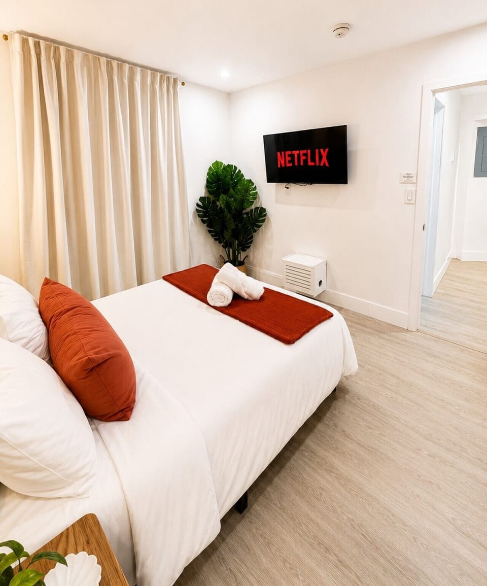 Thoughtfully designed guest room featuring a cozy full-size bed with fresh linens and island-inspired details.