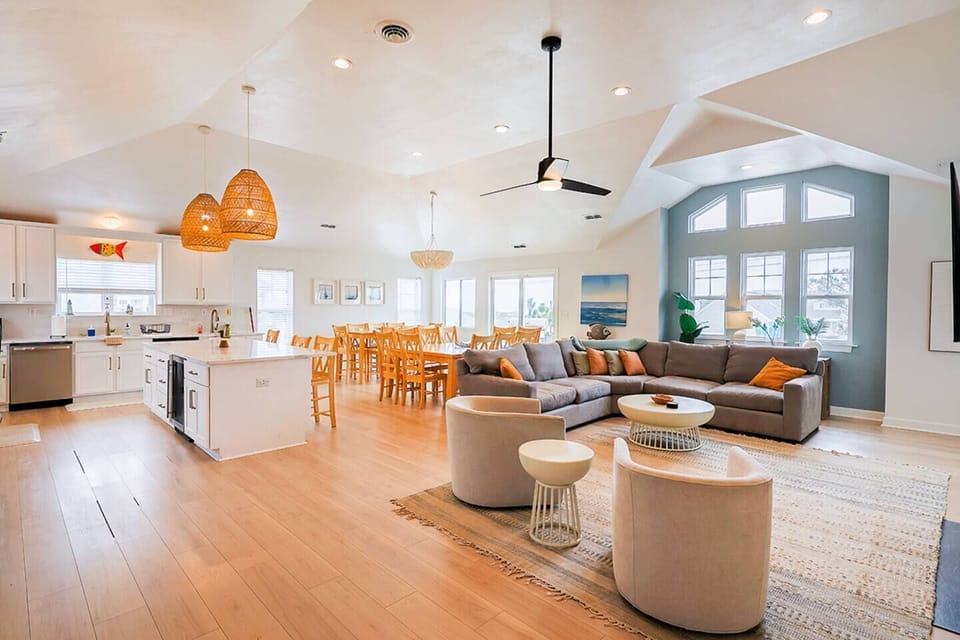 Bright, open-concept living space with vaulted ceilings—perfect for gathering, relaxing, and entertaining.
