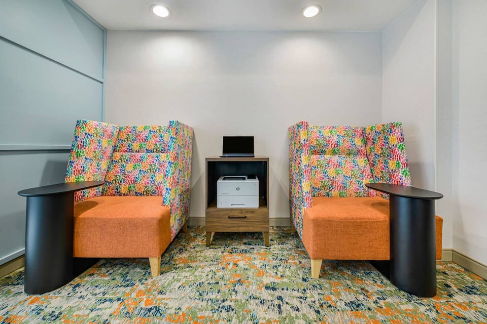 Unwind in cozy seating nooks designed for quiet downtime.