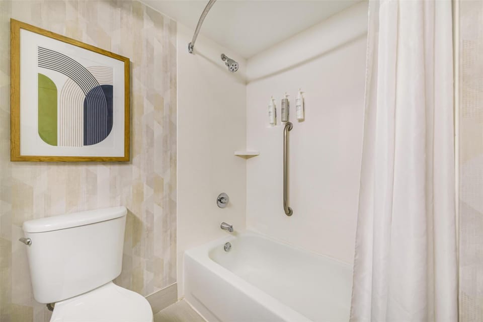 Refresh with a clean tub-shower combo and bright lighting