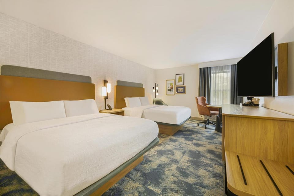 Stretch out in a spacious room with two inviting beds.