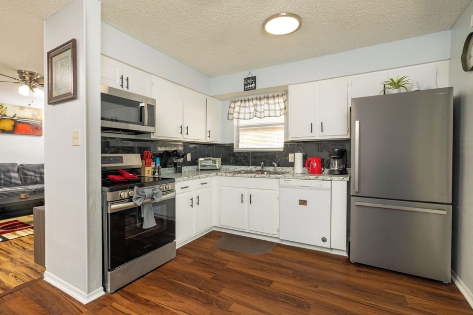 Modern kitchen with stainless appliances and easy backyard access