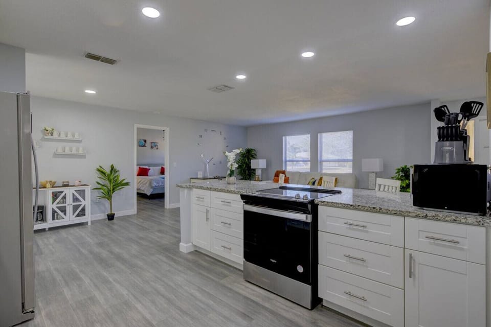 Kitchen: The ultimate hub for morning coffee, casual snacks, and evening conversation.