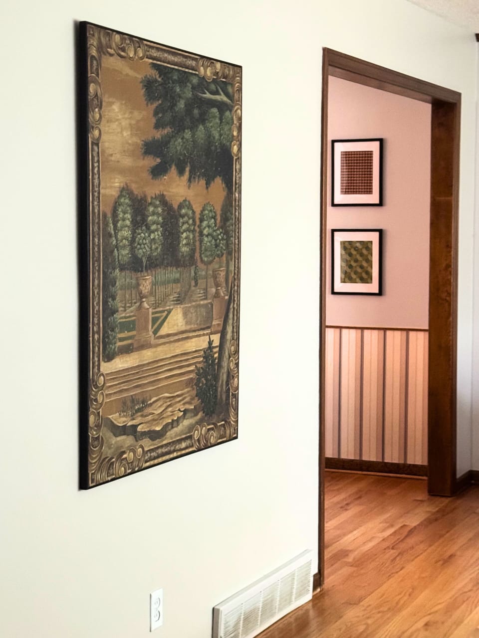 Hallway artwork and warm wood accents add timeless character.