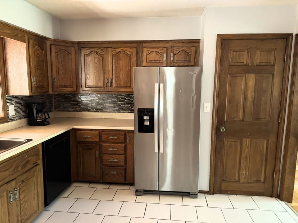 Clean modern kitchen with ample storage and practical design.