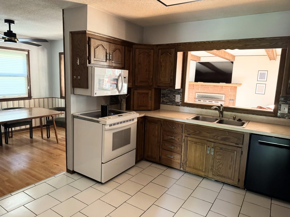 Bright kitchen with wood cabinetry and functional layout.
