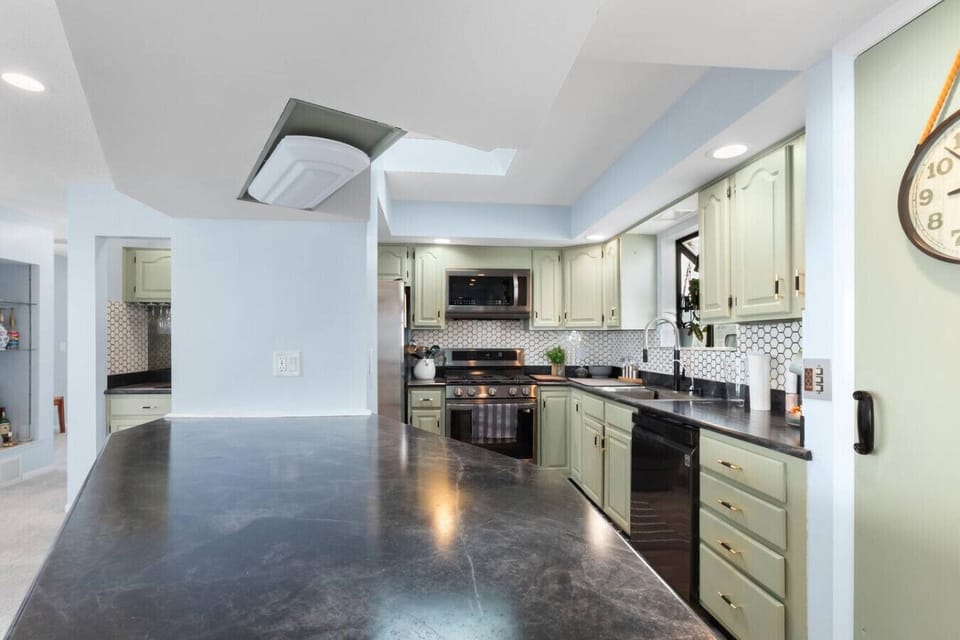 Fully stocked kitchen with generous counter space and everything needed for group meals.