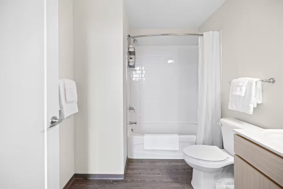 Unwind after adventures with a clean tub-shower combo.