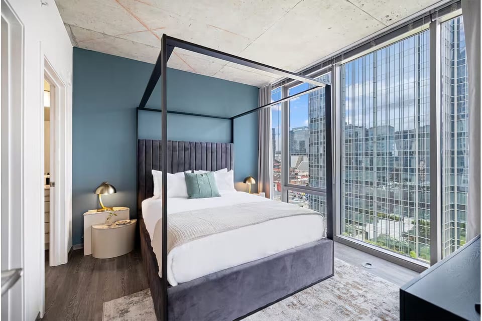 Wake up to breathtaking views from a statement canopy bed.