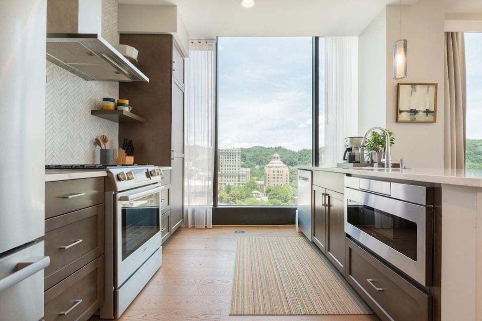 Kitchen with 5 burner gas stove, dishwasher, microwave, Keurig Duo and refrigerator