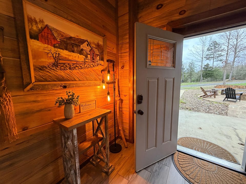 The entry welcomes you with warm lighting and rustic charm, setting the tone for a comfortable countryside escape