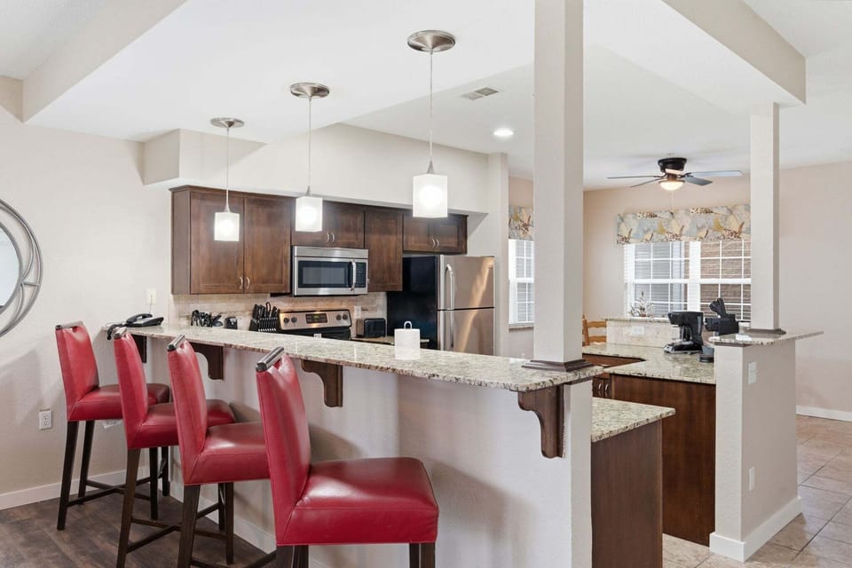 Full Kitchen with Upgraded Appliances and Additional Bar Seating