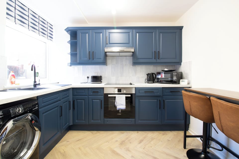 A clean, modern kitchen fully equipped for everything from quick breakfasts to home-cooked dinners.