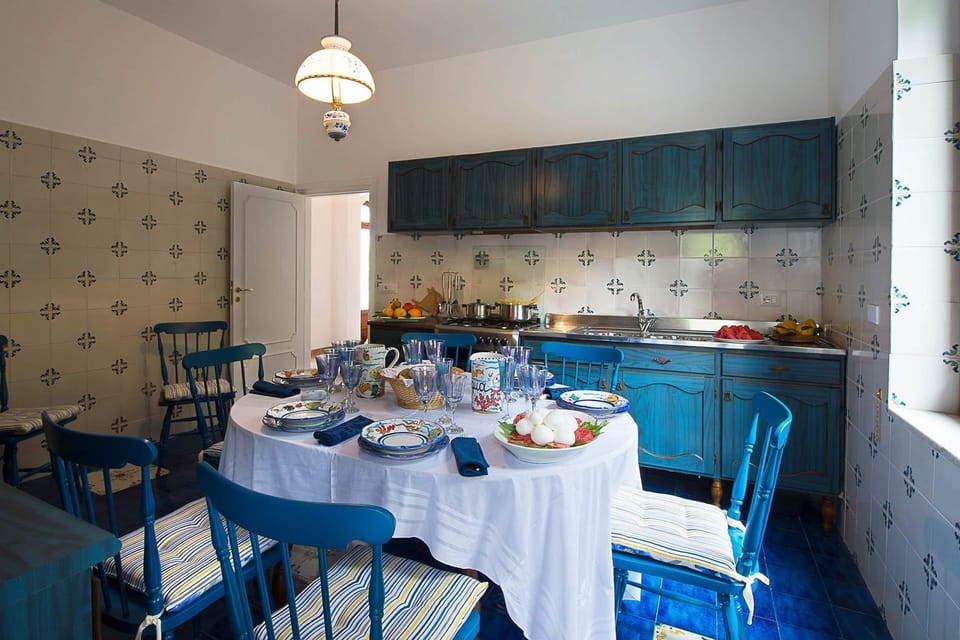 Furniture, Blue, Interior Design, Flooring, Table, Textile, Dining Room, Tablecloth, Lighting, Chair