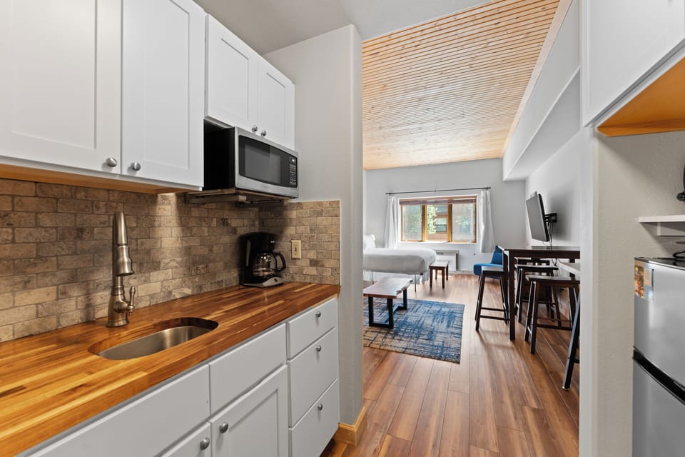 Kitchenette with microwave, toaster oven, and mini fridge.