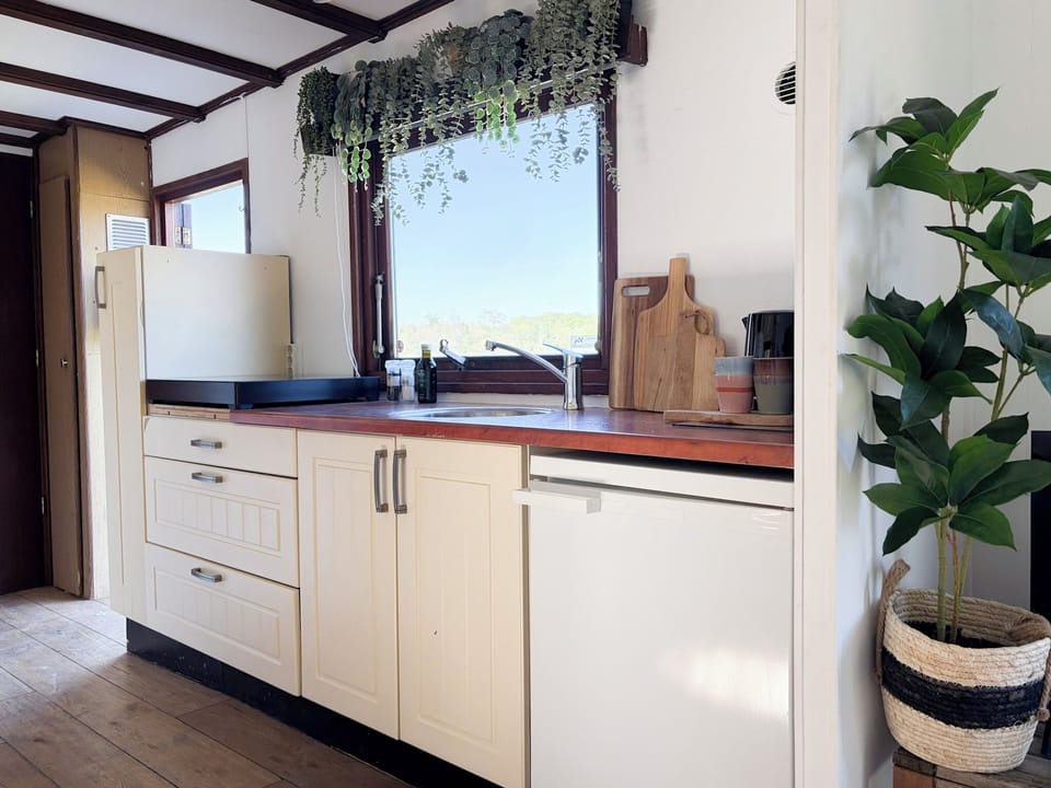 Fully equipped kitchen in your tiny stay Netherlands—cook, dine, and feel at home.