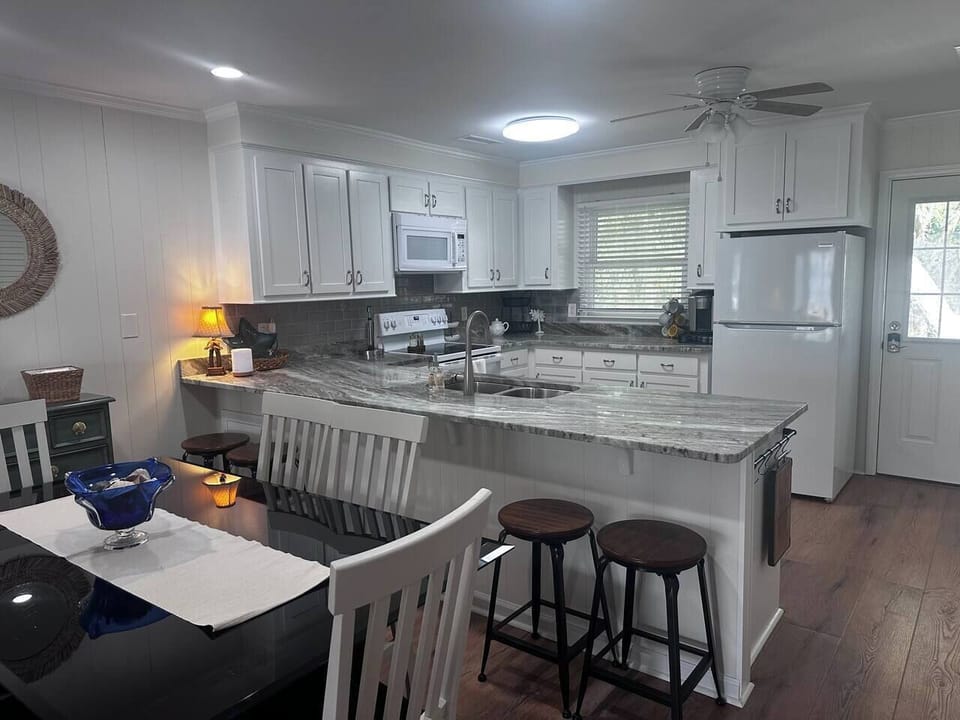 Fully stocked kitchen and dining area.