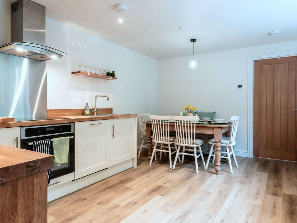 Furniture, Interior Design, Flooring, Floor, Cabinetry, Wood Flooring, Wood, Kitchen Appliance, Countertop, Kitchen